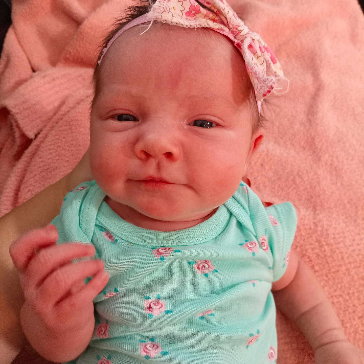 Madisyn is registered to the contest to win money with this photo: accessories, applique, baby, blanket, bodypart, bonnet, clothing, face, finger, hand, hat, head, headband, newborn, pattern, person, photography, portrait, t_shirt, towel