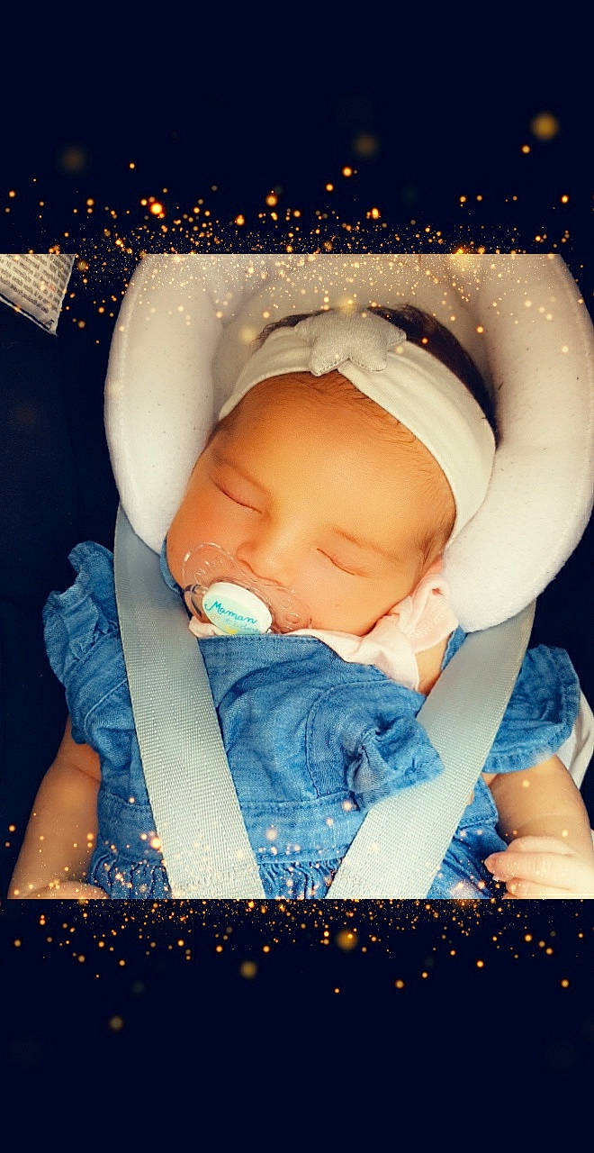 Aria participe au concours pour gagner de l'argent avec cette photo : baby, baby_products, baby_sleeping, baby_toddler_clothing, blue, cheek, child, electric_blue, eye, flash_photography, fun, happy, headgear, human_body, iris, light, mouth, person, skin, toddler