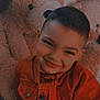 child, boy, smile, orange_jacket, teddy_bear, plush_toy, indoor, portrait, happy, cute, cozy, soft_toy, childhood, warm_colors, casual_clothing, young, face, person, candid, closeup