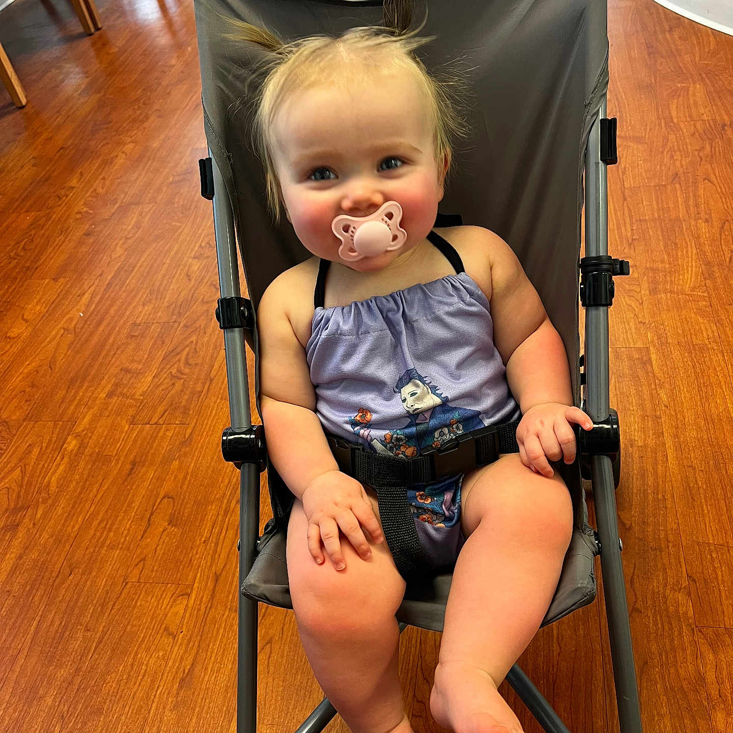 Evie joined the competition — help win amazing prizes! accessories, architecture, baby, bag, building, chair, clothing, face, furniture, handbag, hardwood, head, pants, person, photography, portrait, shorts, sitting, stroller, wood