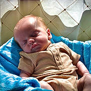 Waylon Hood joined the competition — help win amazing prizes! baby, blanket, blue, clothing, cozy, curtain, cute, face, head, indoors, infant, peaceful, portrait, resting, skin, sleeping, soft, striped, sunlight, toddler