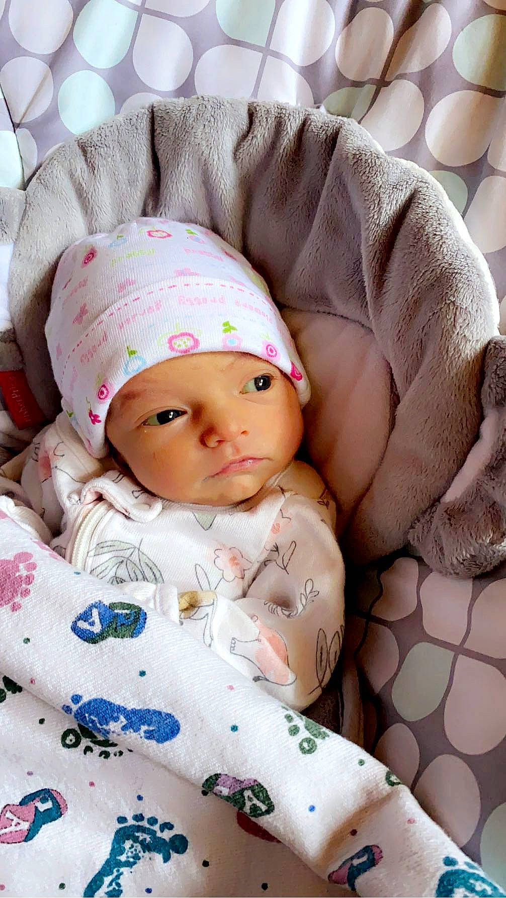 Evelynn is registered to the contest to win money with this photo: baby, baby_products, baby_sleeping, baby_toddler_clothing, cap, cheek, child, comfort, eye, eyelash, hat, headgear, headwear, knit_cap, linens, lip, pattern, person, pink, skin