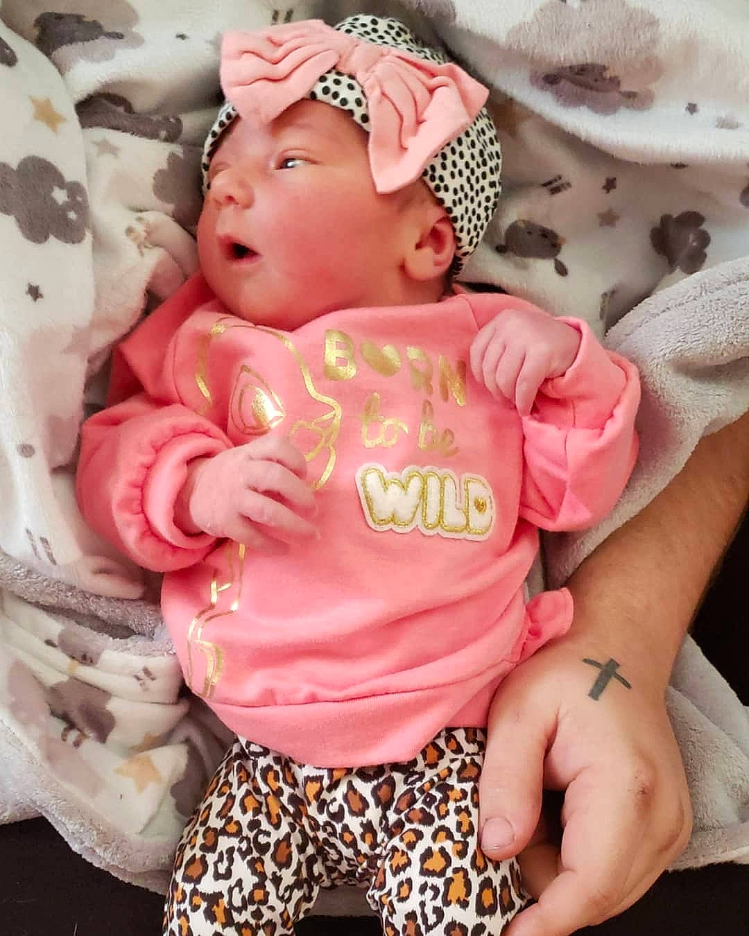 Adilynn is registered to the contest to win money with this photo: baby, baby_products, baby_toddler_clothing, child, headgear, headwear, pattern, peach, person, pink, product, smile, toddler