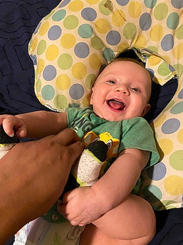 Keith is registered to the contest to win money with this photo: baby, baby_products, child, hand, happy, pattern, person, play, product, smile, toddler, yellow