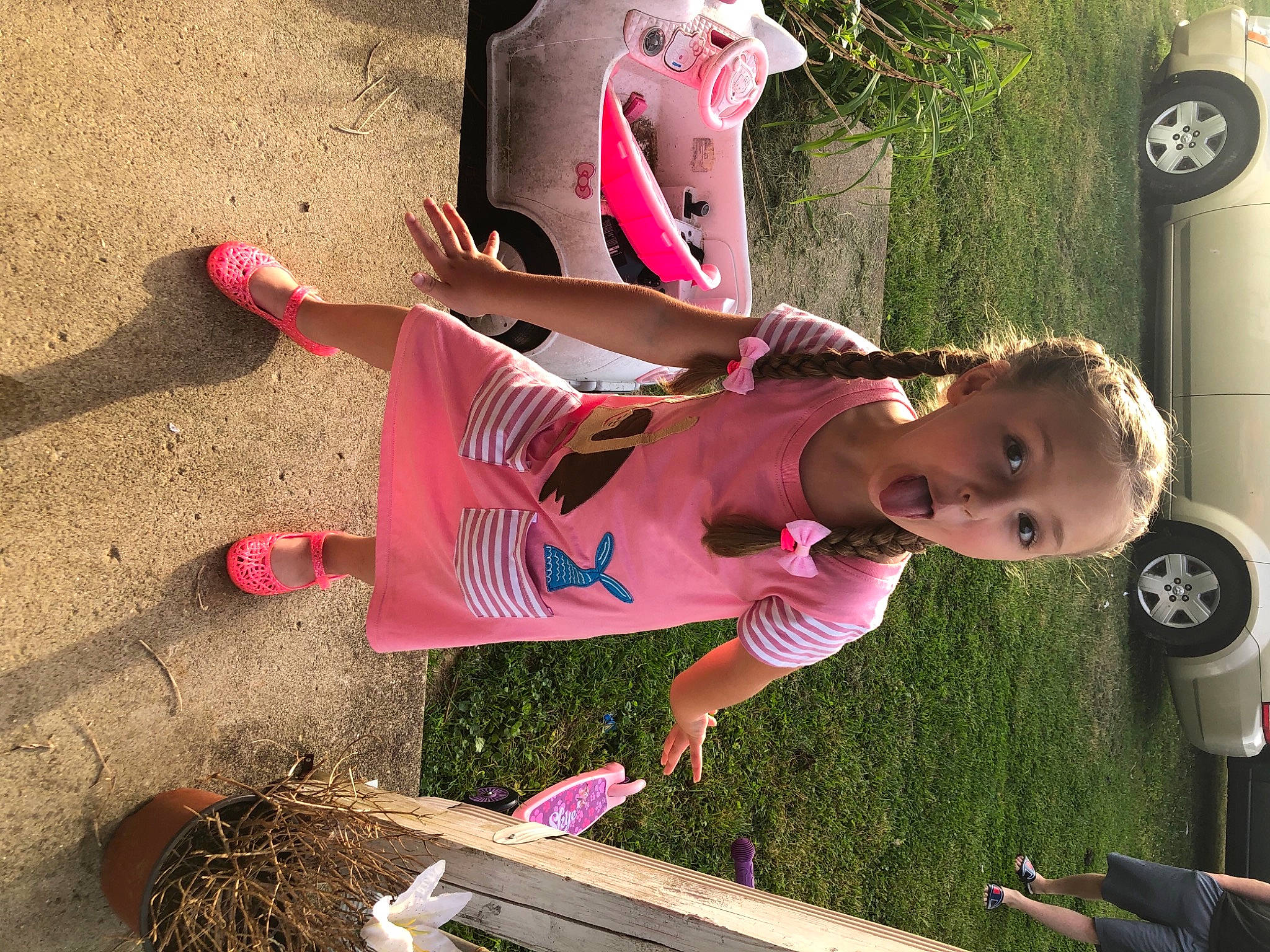 Scotlyn joined the competition — help win amazing prizes! automotive_exterior, baby, baby_toddler_clothing, child, clock, fun, grass, green, happy, leisure, magenta, person, pink, plant, play, recreation, sandal, soil, tire, toddler