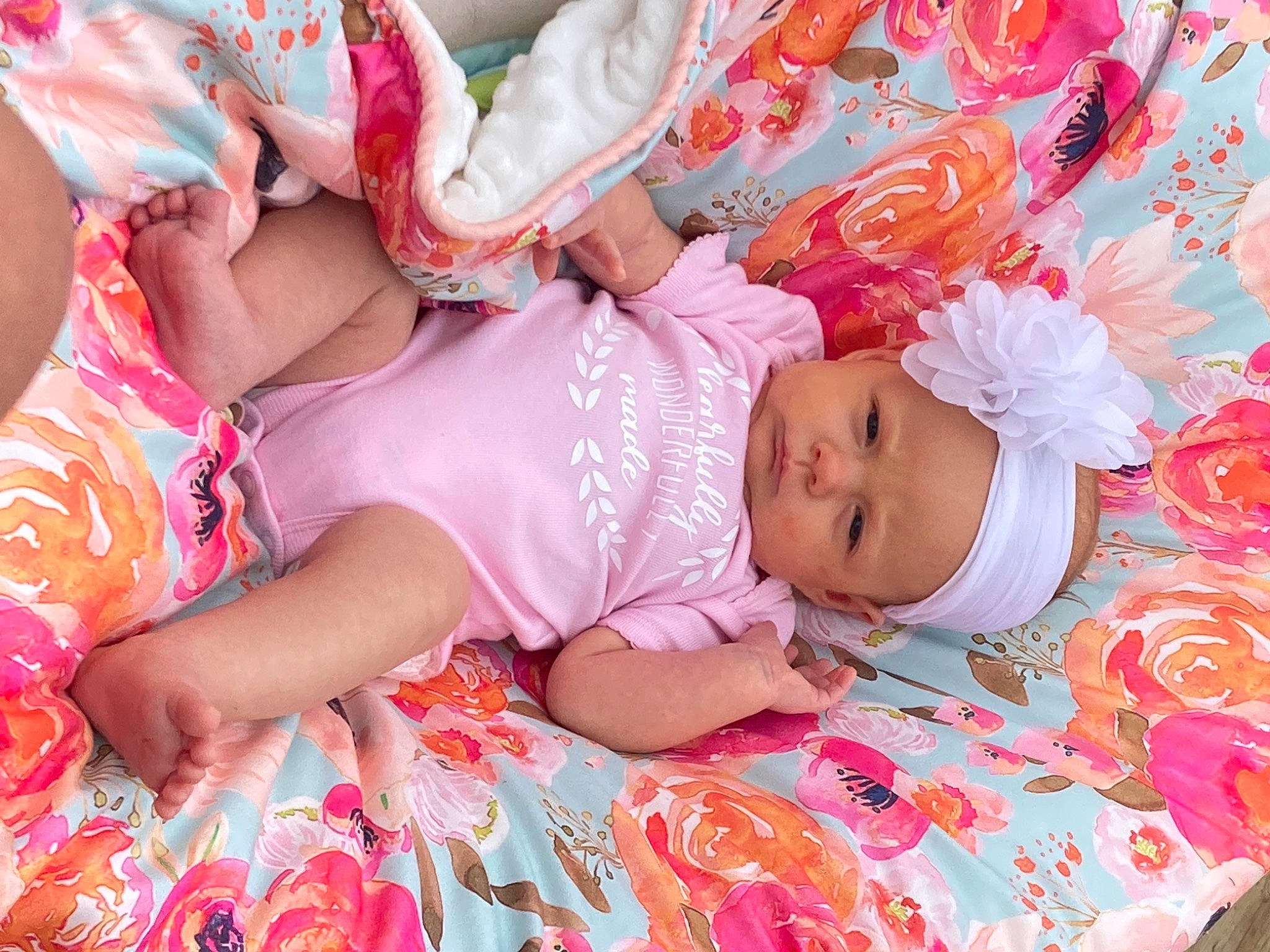 Lillie is registered to the contest to win money with this photo: abdomen, baby, baby_toddler_clothing, cheek, child, dress, finger, happy, headwear, human_body, human_leg, magenta, nail, pattern, peach, person, pink, product, skin, textile