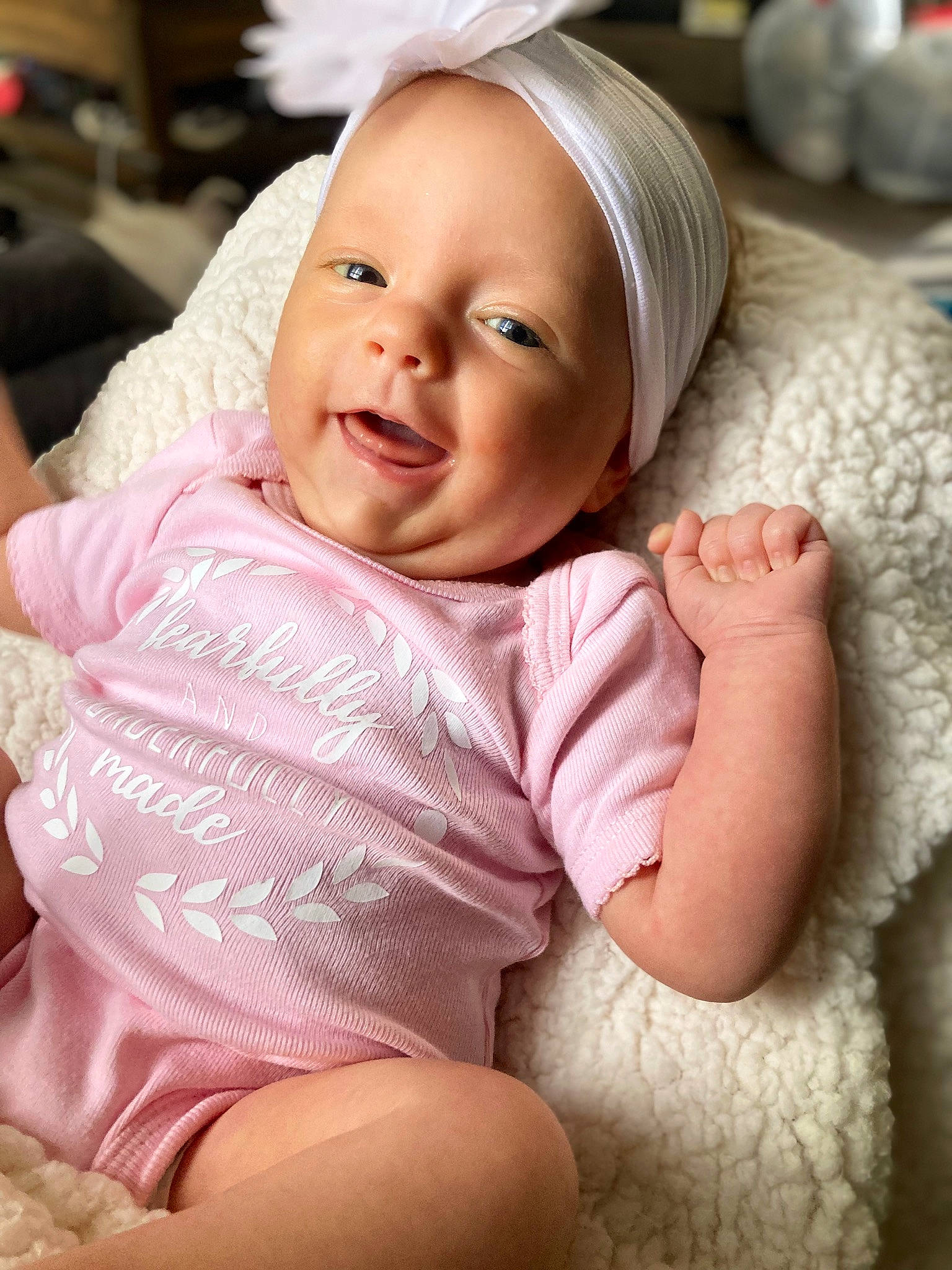 Lillie is registered to the contest to win money with this photo: baby, baby_toddler_clothing, cheek, comfort, eye, eyebrow, face, finger, hand, happy, human_body, iris, lip, mouth, nose, person, pink, skin, smile, textile