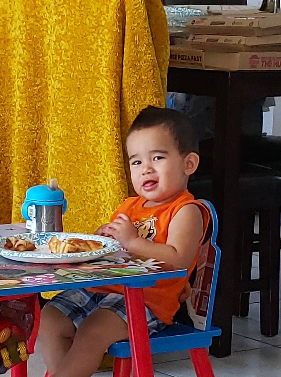 Ezio is registered to the contest to win money with this photo: child, eating, person, sitting, toddler, vacation, yellow