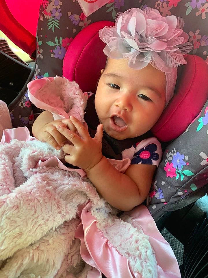 Aria is registered to the contest to win money with this photo: baby, cheek, child, fashion_accessory, hair_accessory, headgear, headwear, person, photography, pink, toddler
