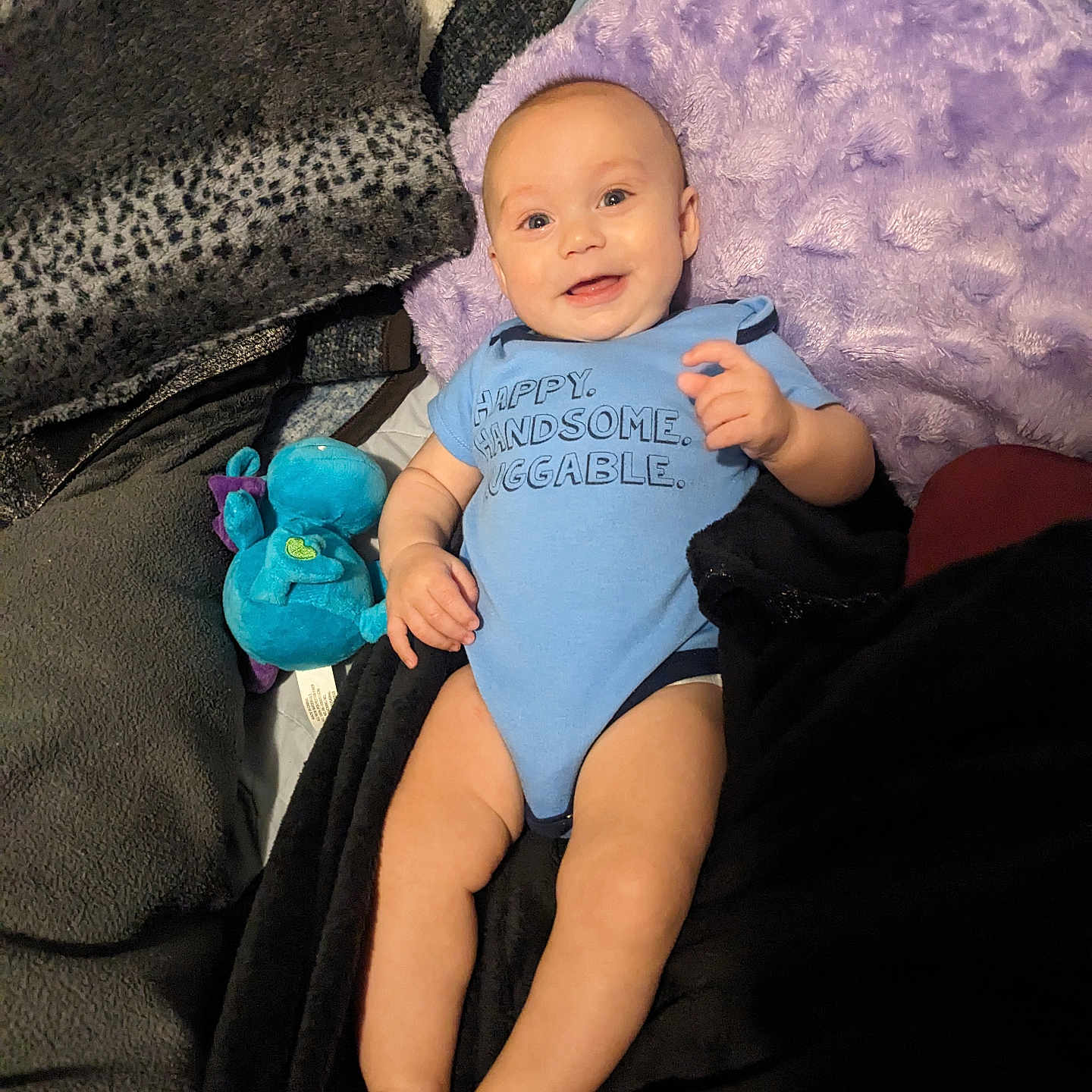 Julius Blade Hudson is registered to the contest to win money with this photo: baby, bed, blanket, bodypart, clothing, couch, cushion, face, finger, furniture, hand, hat, head, homedecor, newborn, person, photography, portrait, sitting, toy