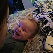 Gabriel is registered to the contest to win money with this photo: adult, baby, babylaughing, bed, bedroom, cushion, face, female, furniture, happy, head, homedecor, indoors, laughing, newborn, person, photography, portrait, room, woman