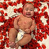 baby, child, infant, smiling, portrait, lying_down, rose_petals, red_flowers, valentines_day, heart_decoration, diaper, bare_chested, outdoorless, close_up, happy, face, arms, legs, blanket, photography