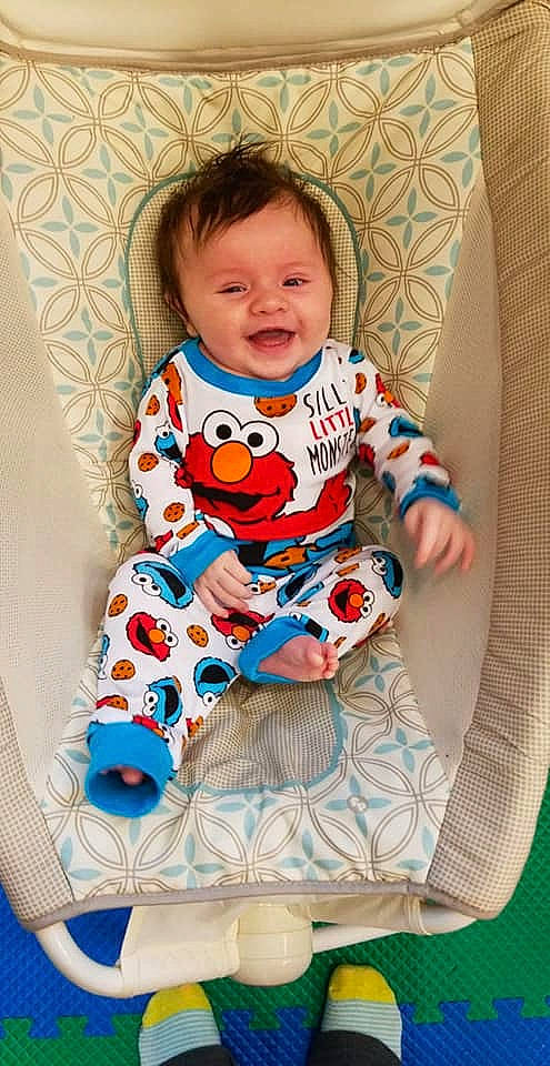 Cayden is registered to the contest to win money with this photo: baby_products, baby_toys, child, fun, infant, material, pattern, person, play, product, sitting, skin, smile, textile, toddler, toy