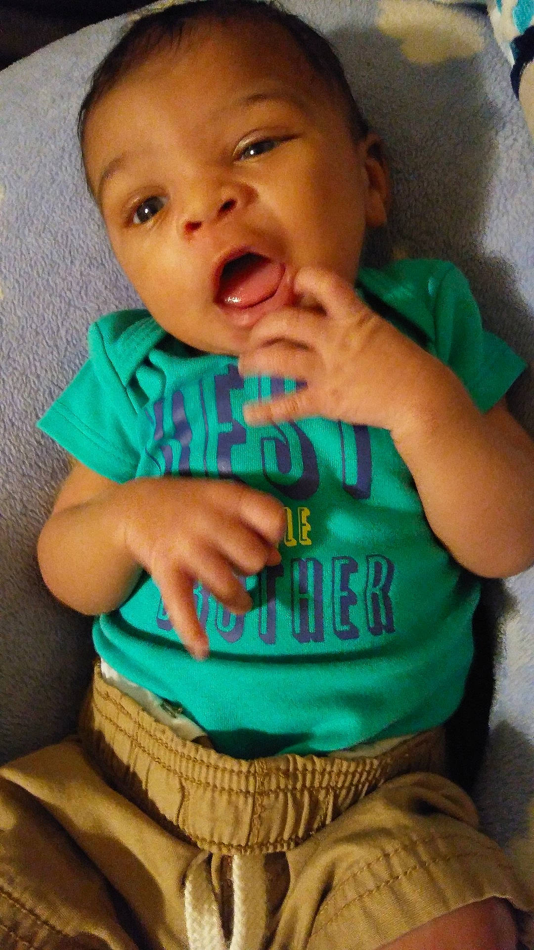 Mikah is registered to the contest to win money with this photo: child, day, eating, facial_expression, infant, organ, person, play, skin, smile, toddler