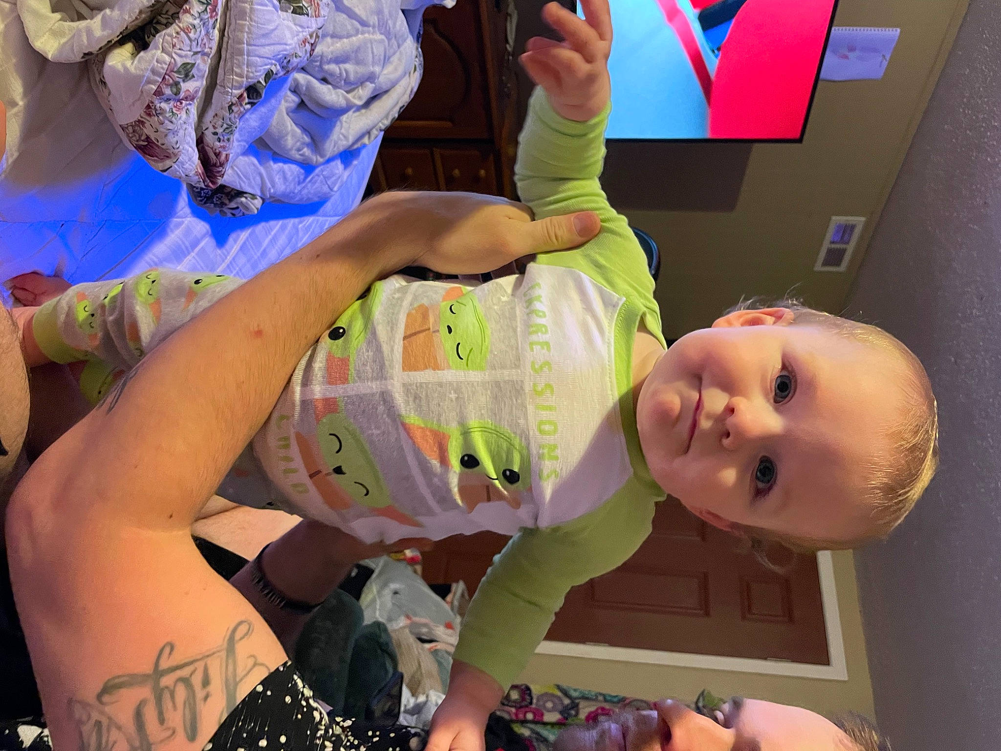 Damon is registered to the contest to win money with this photo: arm, baby, baby_toddler_clothing, blue, child, finger, fun, green, hand, happy, human_body, leg, mouth, person, pink, skin, smile, textile, thigh, toddler