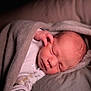 Jude participe au concours pour gagner de l'argent avec cette photo : newborn, baby, sleeping, blanket, soft, face, hand, infant, cozy, bed, closeup, peaceful, cute, skin, portrait, warm_light, resting, wrapped, clothing, indoors