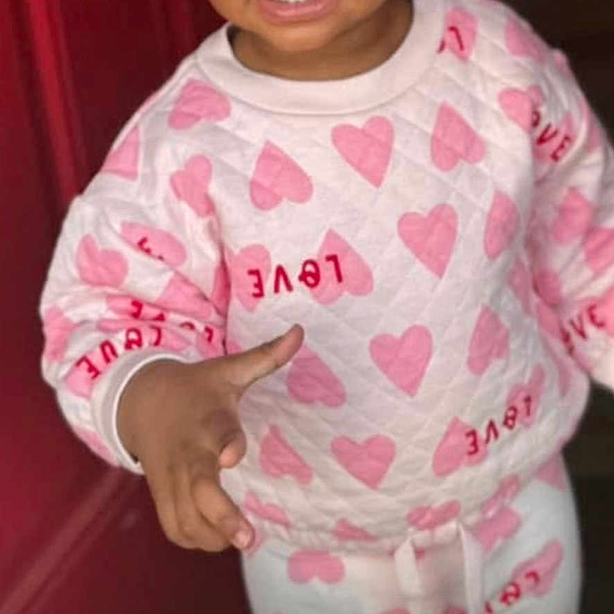 Keyarah joined the competition — help win amazing prizes! beads, braids, child, clothing, cute, door, expression, fashion, gesture, happy, hearts, indoor, pants, person, pink, portrait, smiling, standing, sweatshirt, toddler