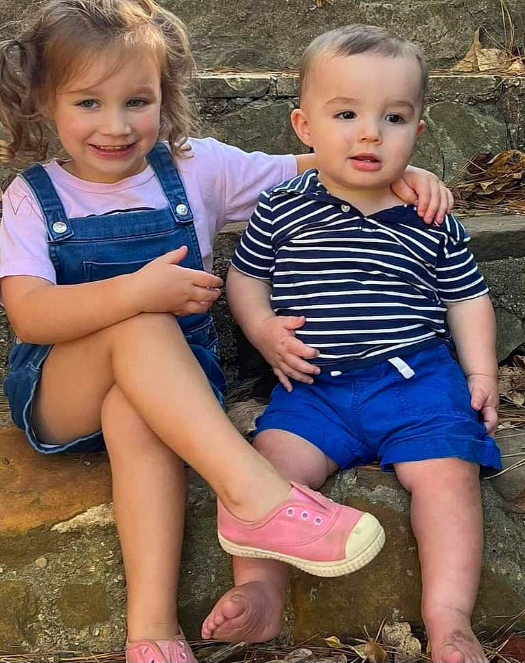 Serenity is registered to the contest to win money with this photo: baby_toddler_clothing, child, dress, face, facial_expression, fun, grass, hand, happy, head, human, human_body, iris, joy, leg, leisure, people_in_nature, person, shorts, skin