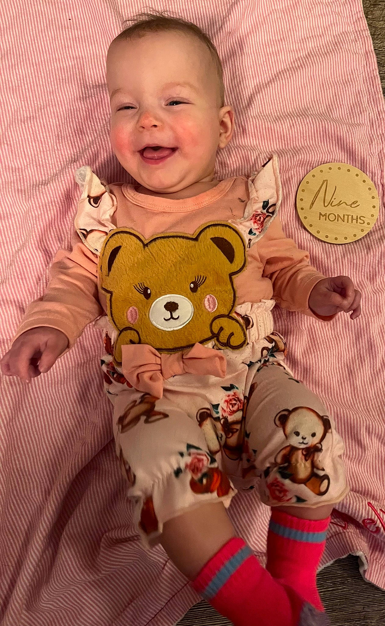 Braelynn is registered to the contest to win money with this photo: baby, baby_products, baby_toddler_clothing, cheek, child, comfort, eye, happy, head, joy, linens, pattern, peach, person, pink, skin, sleeve, smile, stuffed_toy, textile