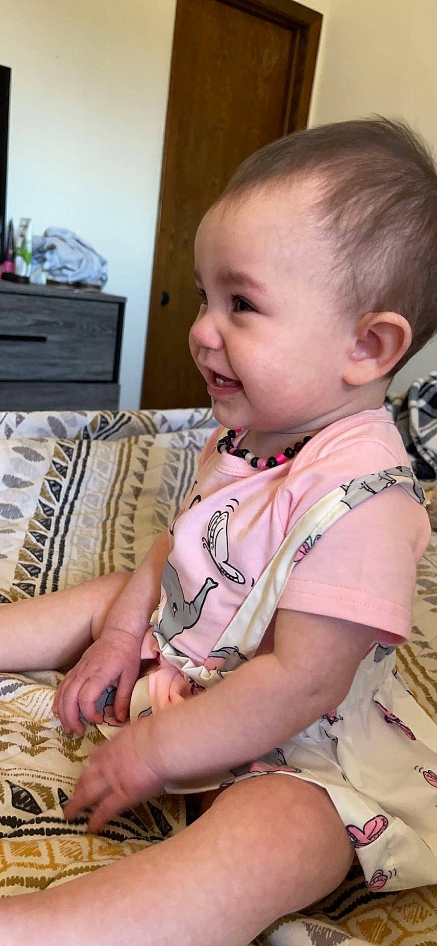 Willow is registered to the contest to win money with this photo: arm, baby, baby_toddler_clothing, cheek, chin, ear, finger, hairstyle, hand, happy, head, human_body, iris, mouth, neck, nose, person, skin, sleeve, smile