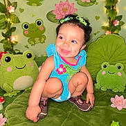 Liliana joined the competition — help win amazing prizes! blue_clothing, child, cute, decorations, fairy_lights, fantasy_theme, flowers, frog_toys, green, hair_bows, happy, indoor, lily_pad, lotus, person, playful, plush, shoes, smiling, toddler