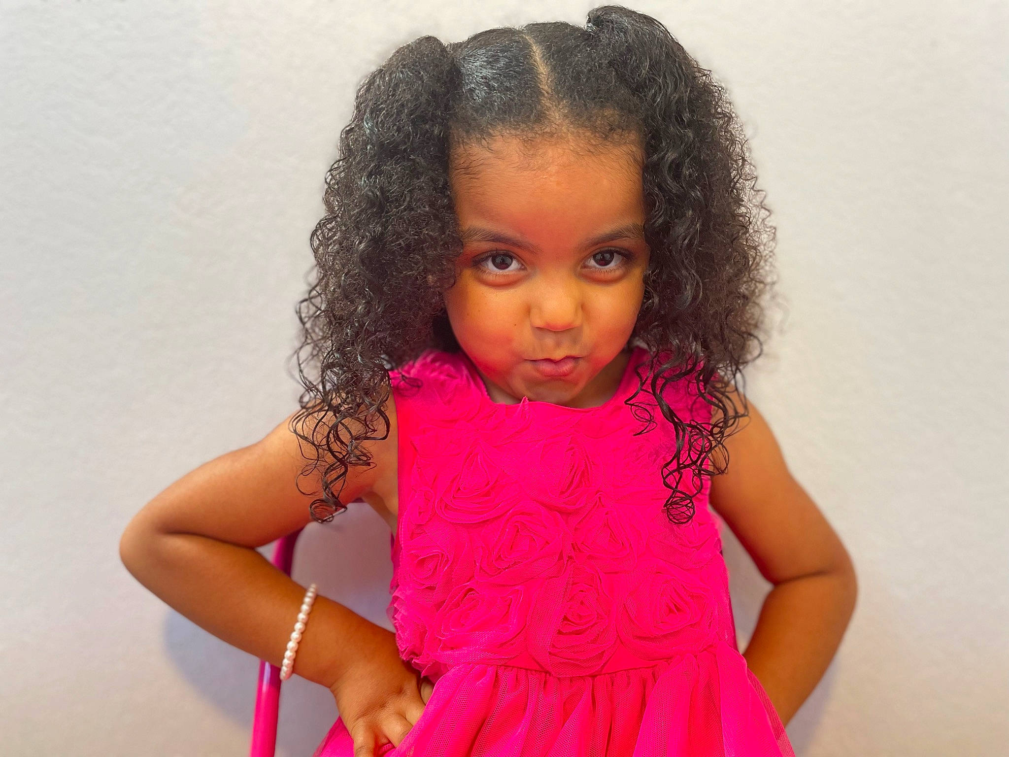 Isabella Dantzler is registered to the contest to win money with this photo: afro, arm, baby_toddler_clothing, black_hair, cheek, chin, eye, eyelash, facial_expression, gesture, hand, happy, iris, lip, nose, one_piece_garment, person, pink, skin, sleeve