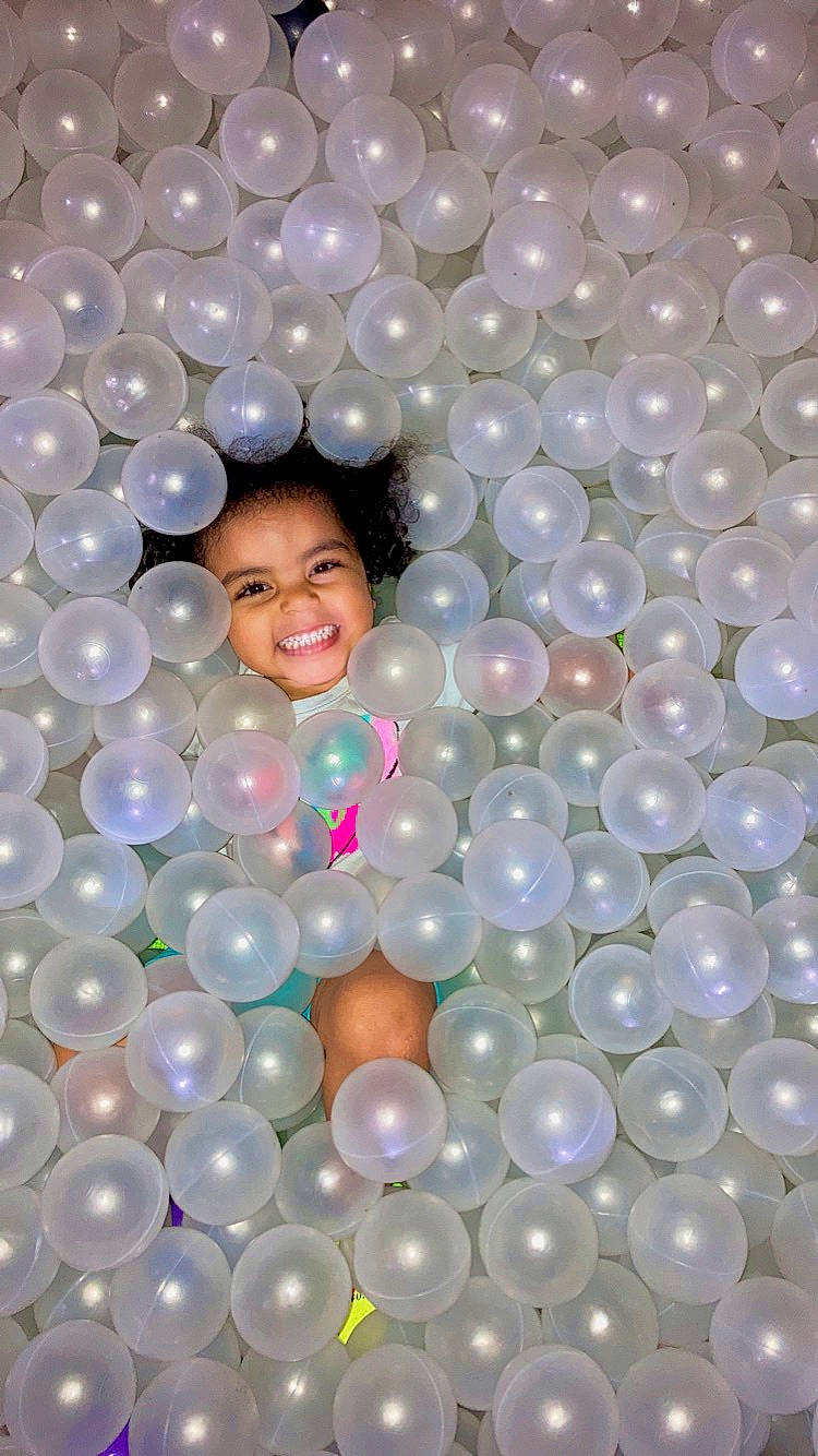 Isabella Dantzler is registered to the contest to win money with this photo: balloon, beauty, child, circle, facial_expression, font, fun, happy, joy, leisure, magenta, material_property, party_supply, pattern, person, photograph, pink, product, smile, toddler