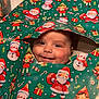 baby, candy_cane, cheerful, child, christmas, cute, elf, face, festive, gift, green_color, holiday, holiday_decor, holiday_spirit, portrait, red_color, santa_claus, smile, snowman, wrapping_paper