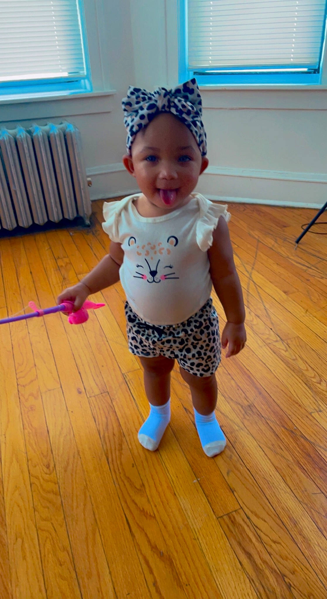 Jordyn joined the competition — help win amazing prizes! baby, baby_toddler_clothing, blue, cap, child, clothing, face, floor, flooring, happy, hardwood, headwear, laminate_flooring, person, sleeve, smile, standing, toddler, white, window