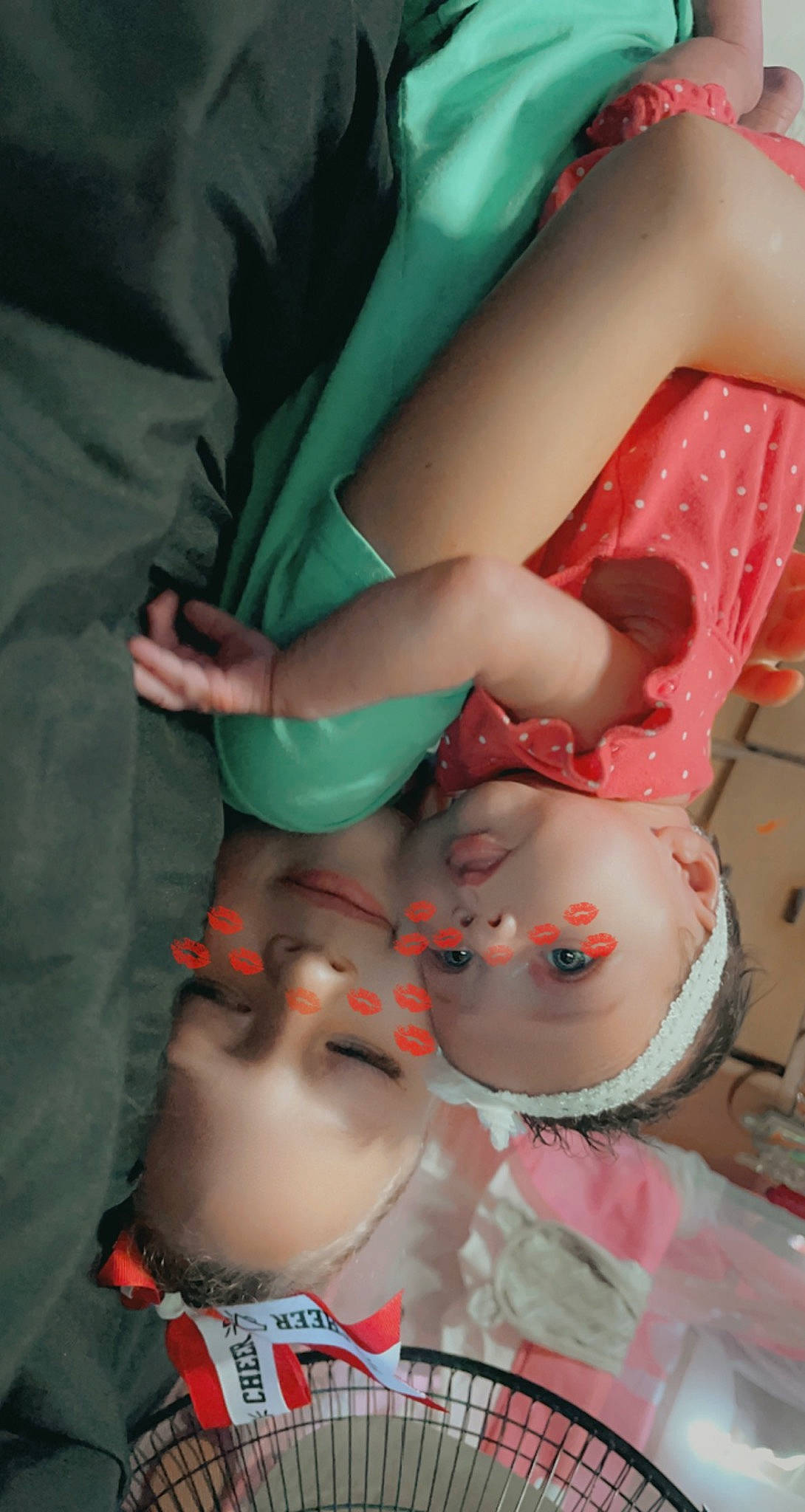 Kiara is registered to the contest to win money with this photo: abdomen, arm, chest, child, elbow, finger, fun, hand, human_body, human_leg, joint, leg, mouth, nail, pattern, person, pink, skin, textile, thigh