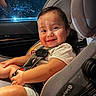 toddler, child, car_seat, smiling, happy, seatbelt, indoor, car_interior, baby, clothing, sitting, person, cute, face, head, shorts, hands, safety, baby_car_seat, infant