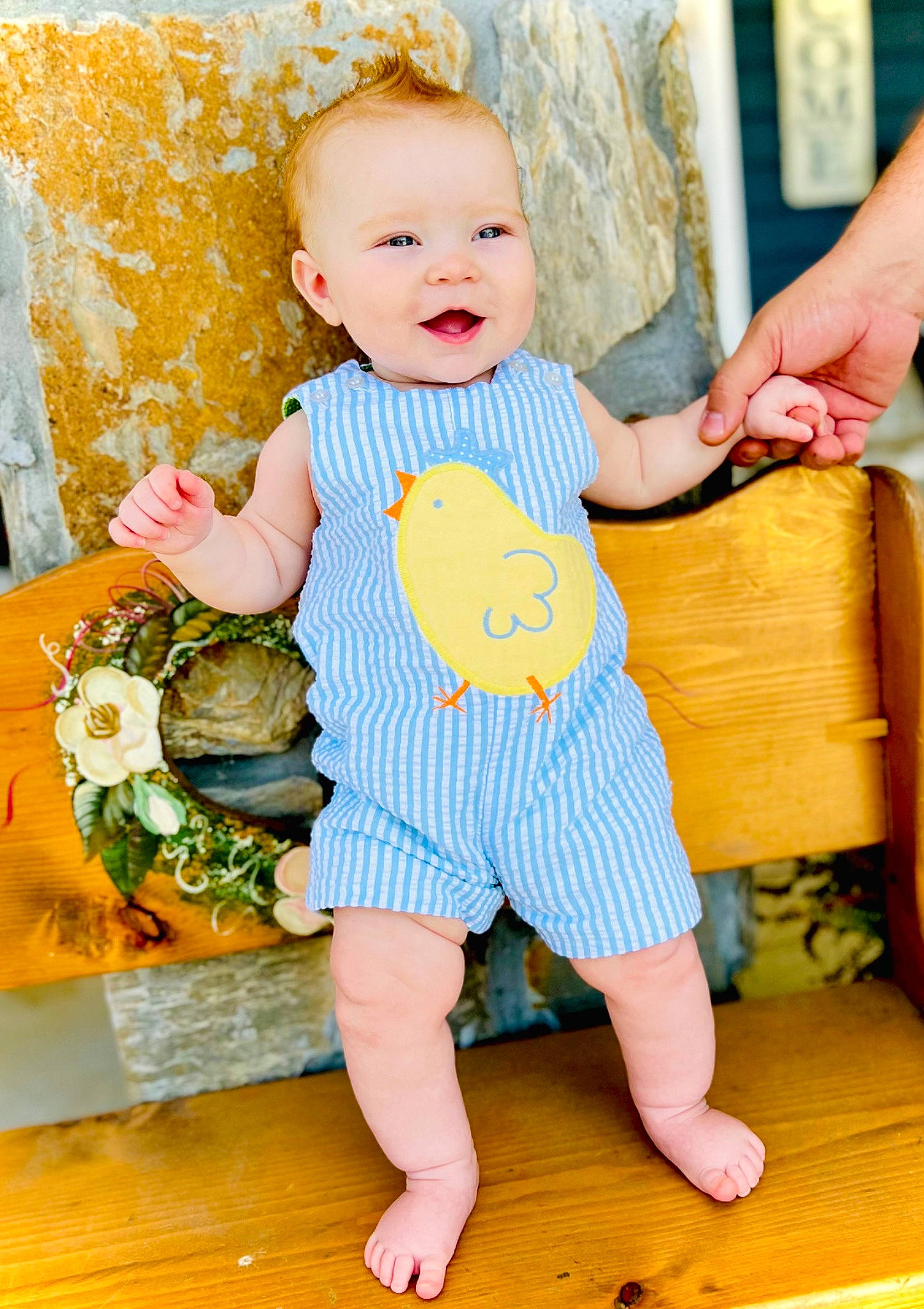 Sterling is registered to the contest to win money with this photo: baby, baby_toddler_clothing, beauty, child, dress, eye, facial_expression, finger, hand, happy, orange, people, person, product, skin, sleeve, smile, textile, toddler, wood