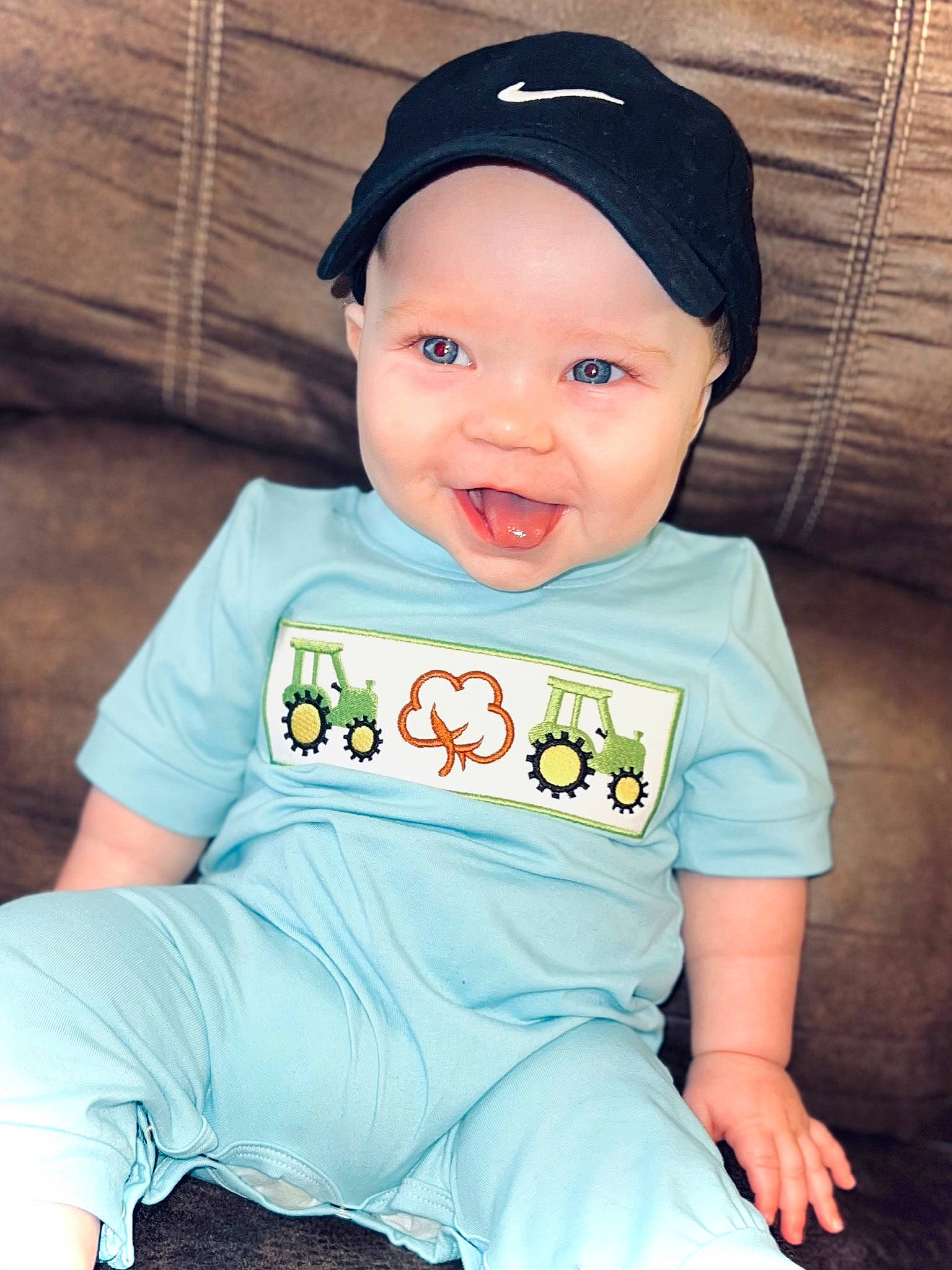 Sterling joined the competition — help win amazing prizes! azure, baby, baby_toddler_clothing, blue, cheek, chin, clothing, cricket_cap, eye, hair, head, headwear, human_body, jeans, lip, mouth, neck, nose, outerwear, person