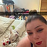 woman, dog, cat, bed, selfie, plush_toy, cat_tree, furniture, clothing, red_lipstick, piercing, casual, indoor, pet, relaxed, bedroom, hair_bun, toy, pet_owner, text_overlay