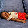 Emori joined the competition — help win amazing prizes! baby, infant, smile, happy, couch, blue_couch, clothing, red_shorts, white_top, stars_pattern, relaxed, indoor, portrait, child, cute, lying_down, skin, face, small_hands, cozy