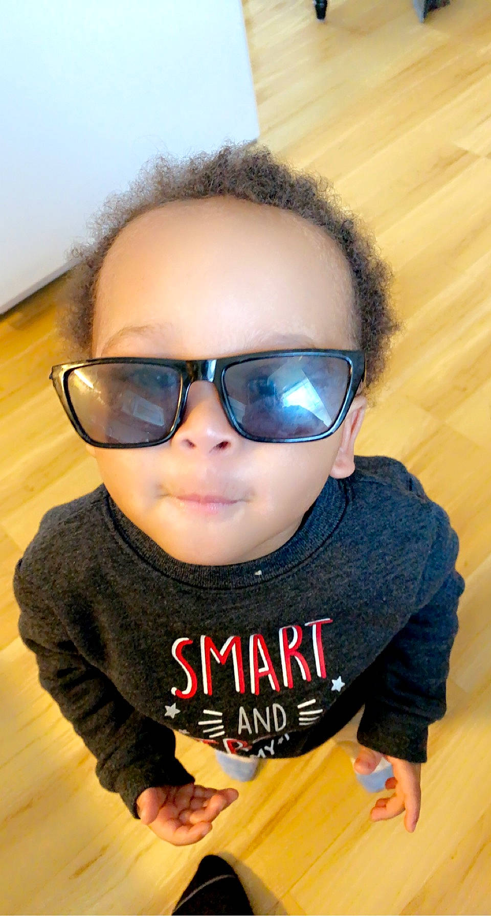 Robert is registered to the contest to win money with this photo: baby_toddler_clothing, cheek, chin, eye_glass_accessory, eyebrow, eyewear, face, facial_expression, glasses, goggles, hairstyle, happy, lip, mouth, nose, organ, person, skin, sleeve, sunglasses