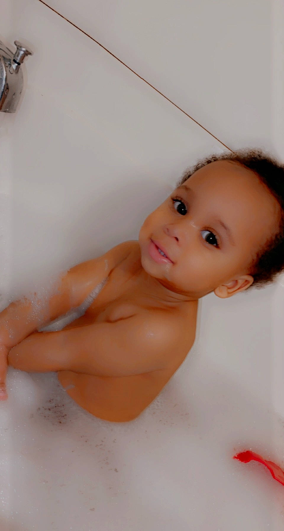 Robert is registered to the contest to win money with this photo: baby, bathing, cheek, chest, chin, eye, eyebrow, eyelash, finger, gesture, head, human_body, iris, lip, mouth, neck, nose, person, skin, stomach