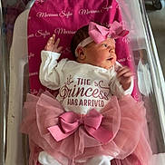 Mariana joined the competition — help win amazing prizes! newborn, baby, infant, hospital, bassinet, pink, tutu, headband, blanket, clothing, person, cute, sleeping_baby, newborn_baby, hospital_room, portrait, baby_girl, text, hospital_card, pink_bow
