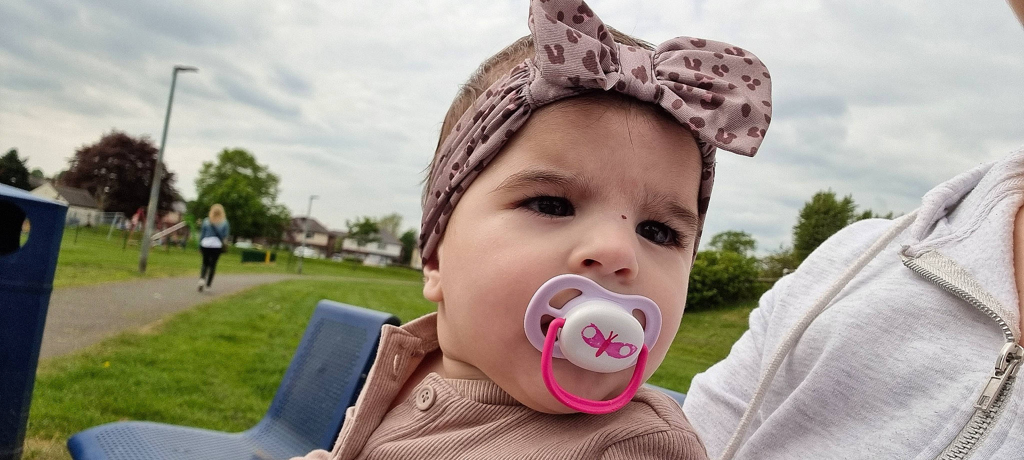 Mira is registered to the contest to win money with this photo: baby, cap, cheek, cloud, ear, eyelash, fun, grass, happy, headwear, iris, lip, mouth, nose, person, pink, plant, product, skin, sky