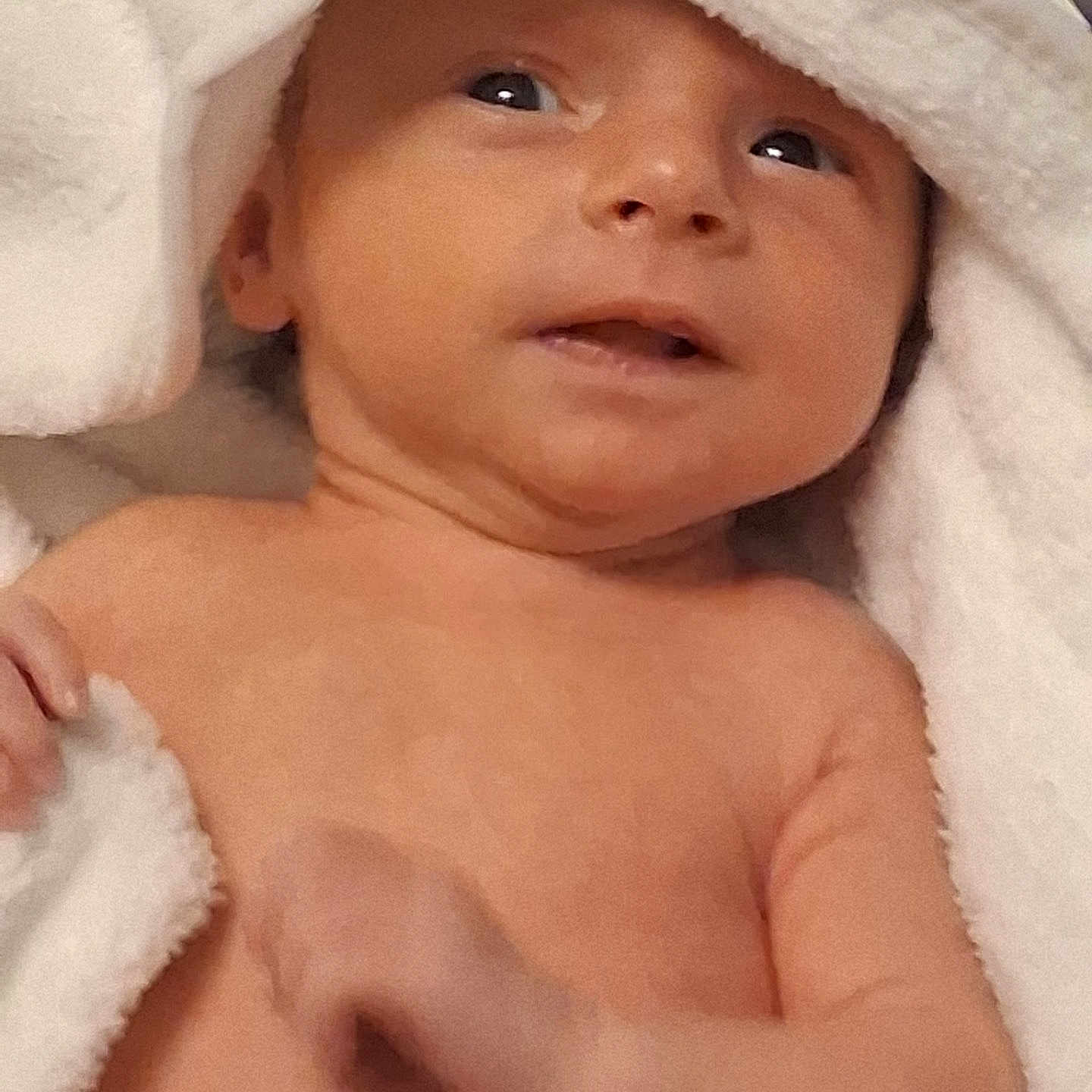 Eva is registered to the contest to win money with this photo: baby, infant, towel, skin, face, eyes, hand, newborn, portrait, cute, child, soft, blanket, expression, closeup, indoors, warm, sleepwear, rest, comfort