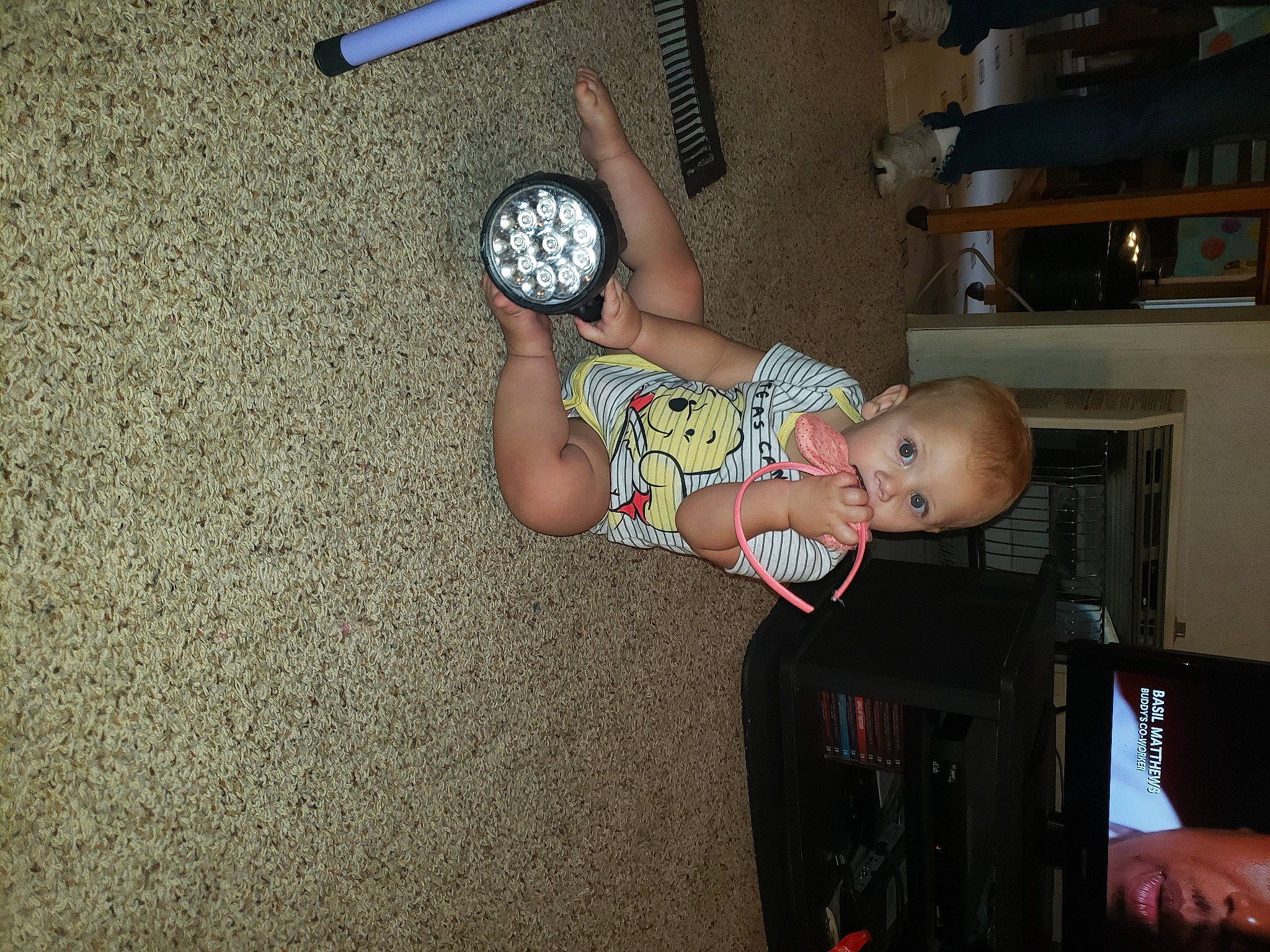 Analicia is registered to the contest to win money with this photo: automotive_tire, automotive_wheel_system, baby, baby_toddler_clothing, child, finger, flooring, foot, fun, hat, human_leg, person, rim, room, sandal, sitting, thigh, tire, toddler, wheel