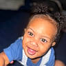 Jaquavion is registered to the contest to win money with this photo: toddler, child, smiling, face, blue_shirt, overalls, happy, cute, portrait, indoor, baby, person, closeup, young_child, skin, hair, eyes, expression, joy, candid