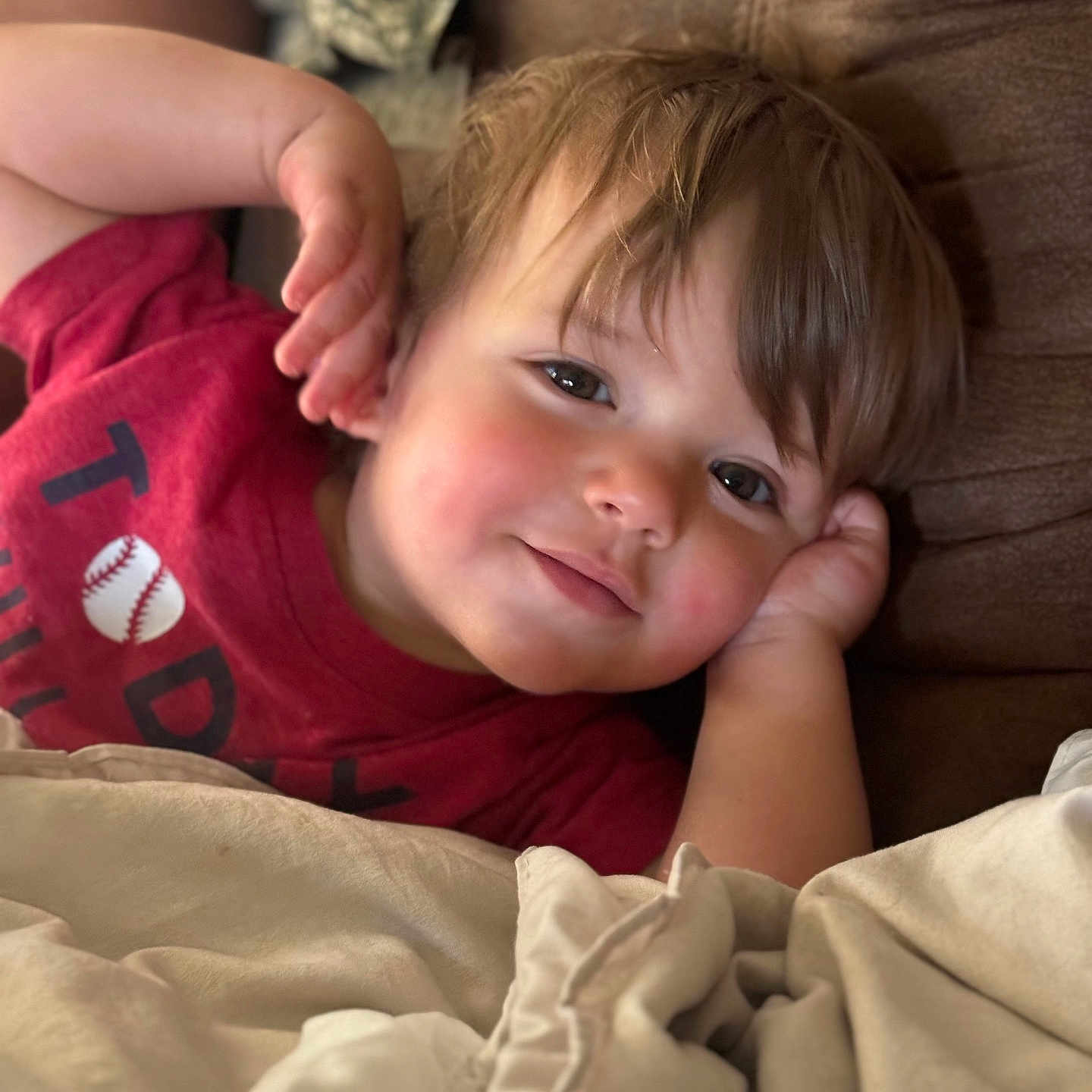 Cooper joined the competition — help win amazing prizes! baby, ball, baseball, baseballball, blanket, bodypart, couch, cushion, face, finger, furniture, hand, happy, head, homedecor, person, photography, portrait, smile, sport