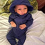 baby, blanket, casual_clothing, comfortable, cozy, crochet, curious_eyes, cute, green, hoodie, indoors, infant, lying_down, navy_blue, pink_socks, portrait, small_hands, soft_texture, white, young_child
