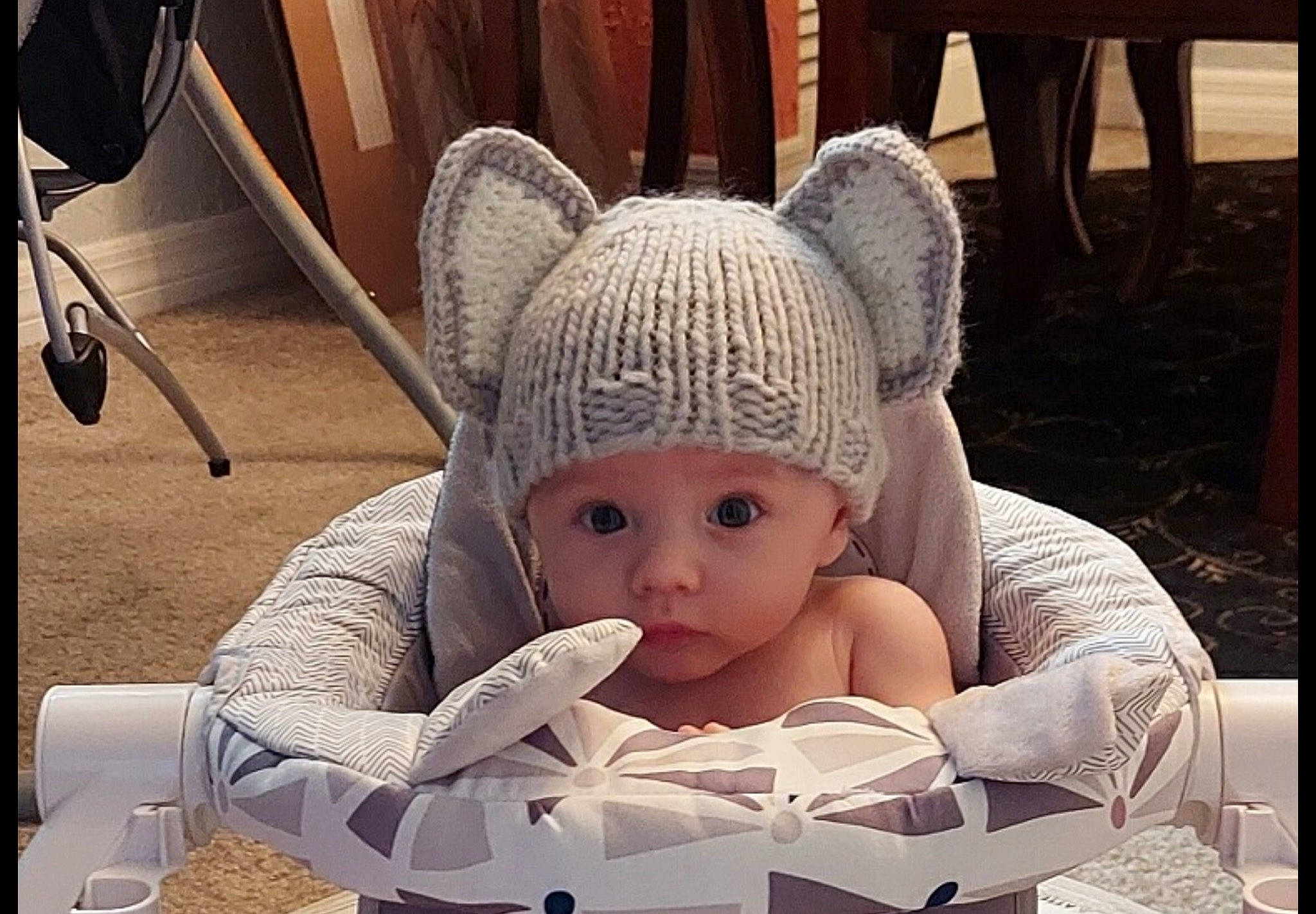 Christopher is registered to the contest to win money with this photo: baby, baby_products, baby_sleeping, baby_toys, cap, chair, child, comfort, flooring, fun, headwear, knit_cap, linens, person, room, sitting, stuffed_toy, textile, toddler, toy