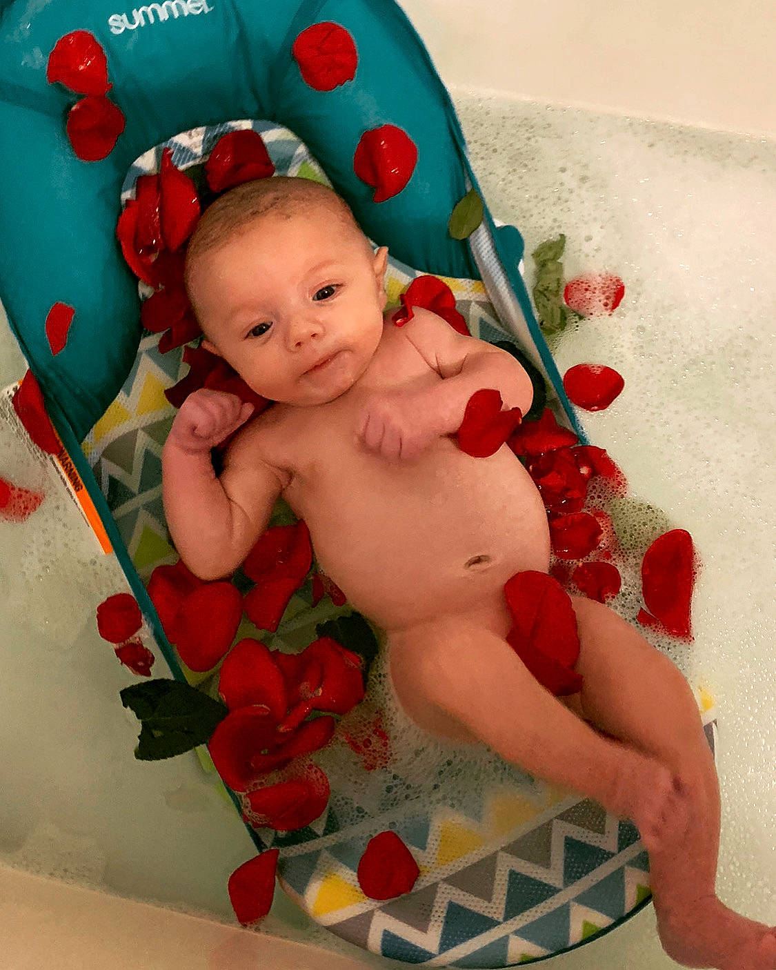 Christopher is registered to the contest to win money with this photo: abdomen, baby, baby_products, baby_toddler_clothing, cheek, chest, child, fictional_character, finger, foot, happy, person, pink, product, red, skin, stomach, textile, thigh, toddler