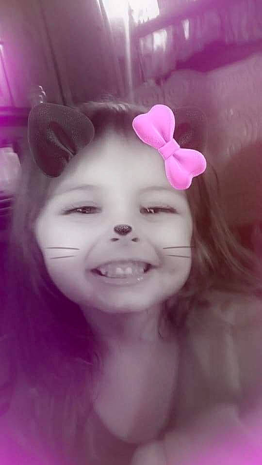 Alanna is registered to the contest to win money with this photo: cheek, ear, eyebrow, eyelash, face, flash_photography, flower, happy, human_body, iris, jaw, joy, lip, nose, person, petal, pink, plant, purple, skin