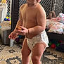 Dominic joined the competition — help win amazing prizes! toddler, child, diaper, indoor, toy, playpen, carpet, snack, barefoot, person, baby, home, furniture, floor, cuboid_block, patterned_rug, cute, young_child, standing, play_area