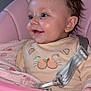 baby, infant, child, smile, face, high_chair, pink, clothing, seatbelt, cute, happy, indoor, person, closeup, portrait, comfort, sitting, soft_toys, fabric, cozy