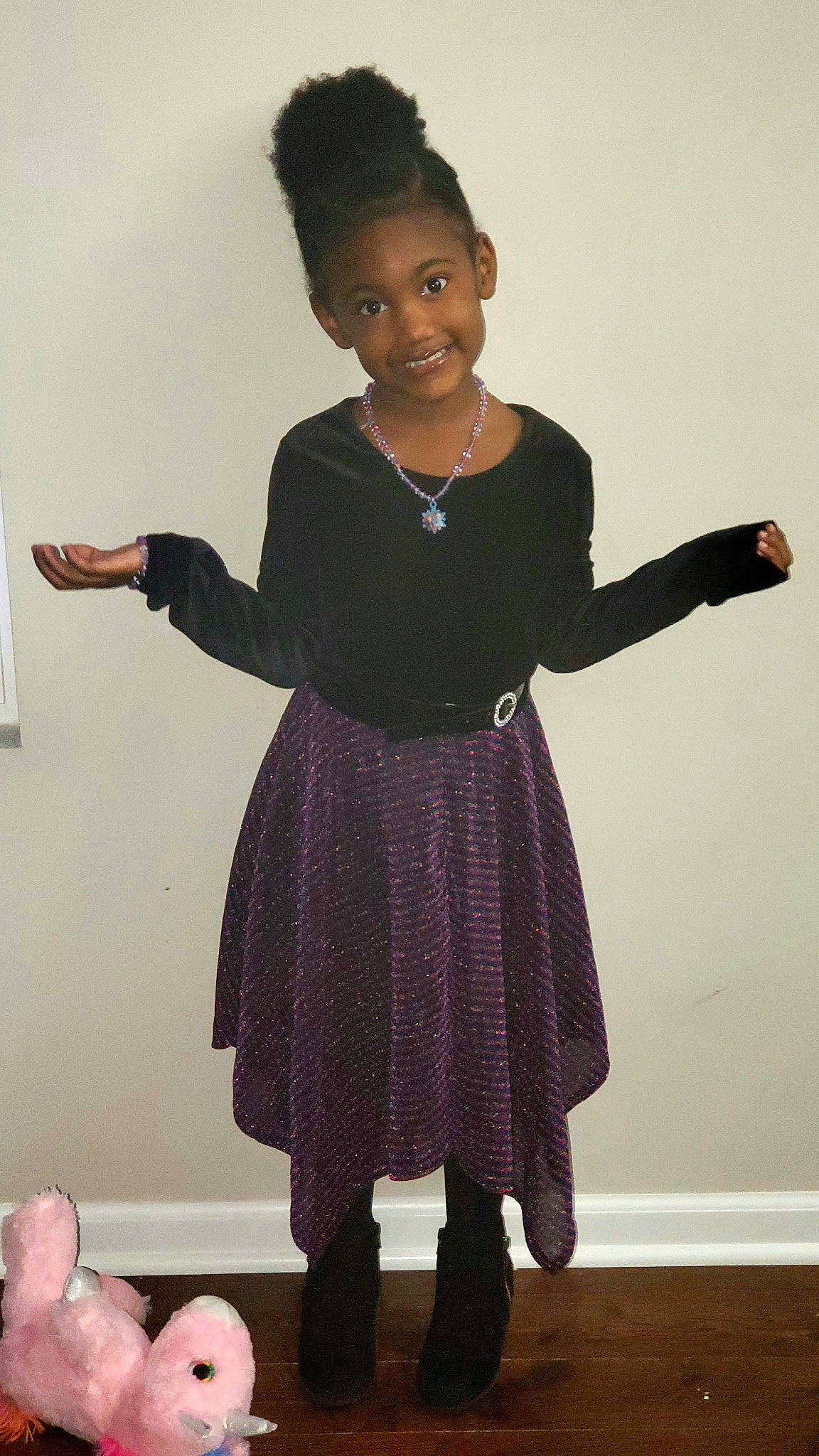 Kamille is registered to the contest to win money with this photo: black, child, clothing, dress, fashion, gesture, joint, joy, leggings, little_black_dress, outerwear, pattern, person, pink, purple, shoe, shoulder, sleeve, standing, sweater